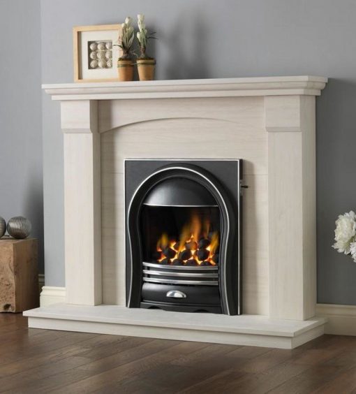 Curved black and metal fireplace set into limestone surround