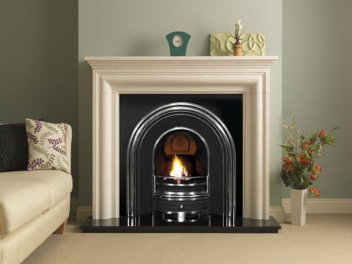 Large arched fireplace in black with silver detailing in living room