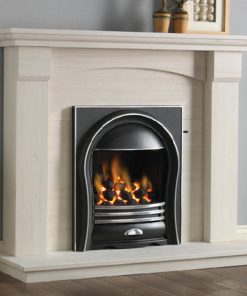 Limestone surround encloses black and metal curved fireplace