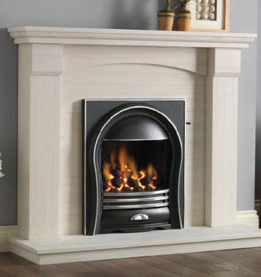 Limestone surround encloses black and metal curved fireplace