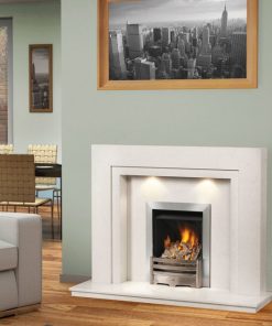 A fire burns in a smart metal fireplace with white surrounds