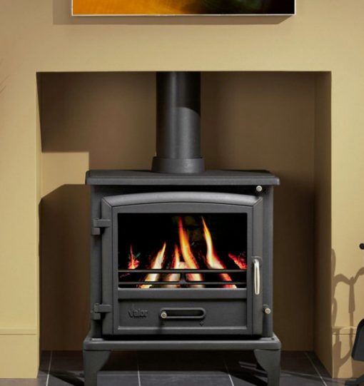 A larger wood burning stove sits on slate tiles