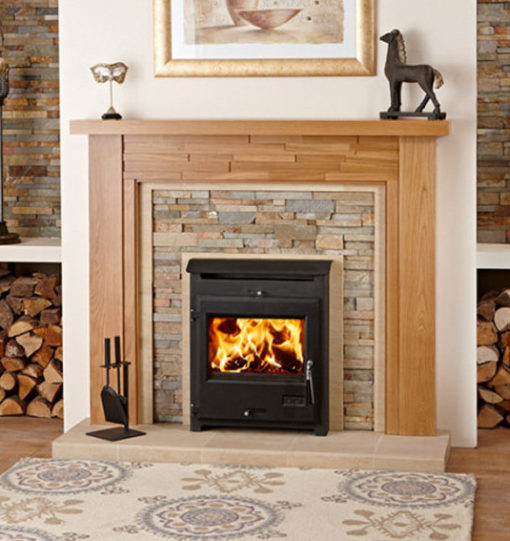 Wood burning stove set in coloured brick surround