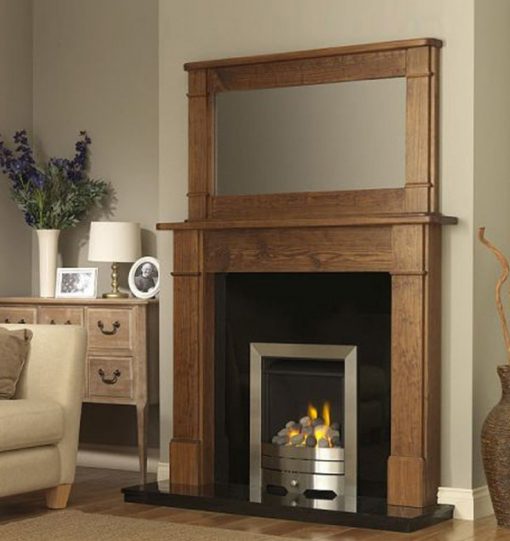 Dark pine surround and mirror over modern fireplace insert