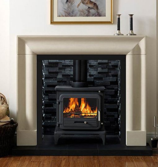 Wood burning stove in black brick fireplace