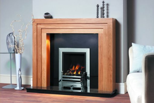 A chrome fireplace insert with modern oak surround