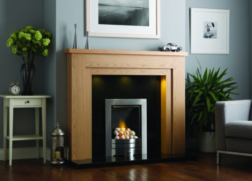 Contemporary oak mantelpiece over a simple modern fireplace