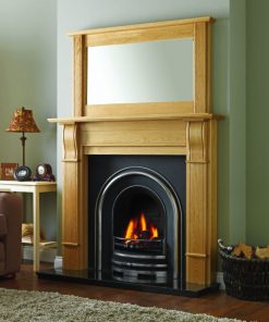 Traditional style surround and mirror over arched fireplace