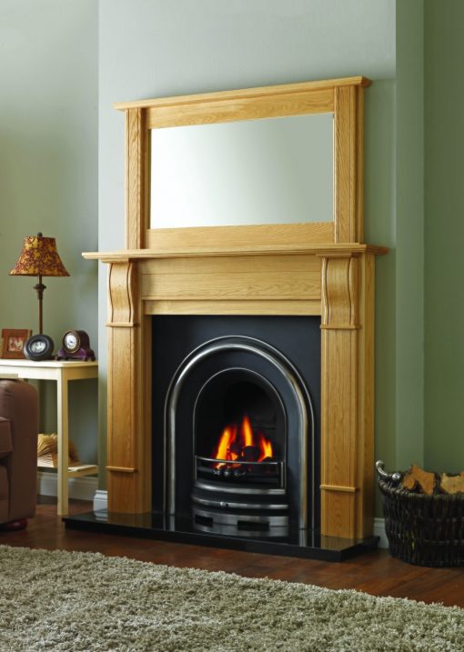 Traditional style surround and mirror over arched fireplace