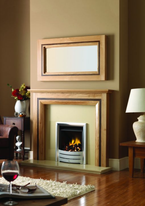 Contemporary oak mantel and mirror over gas fireplace insert