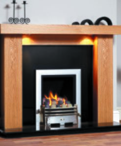 Minimalist fireplace insert in silver with simple wooden surround