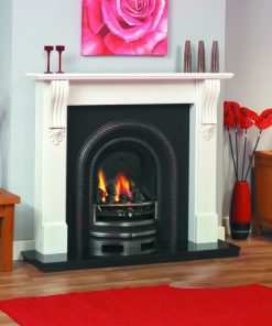 Arched cast iron fireplace in white veneered surround with ornate detailing