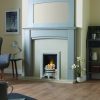 Simple grey fireplace in light blue surround with mirror in country home