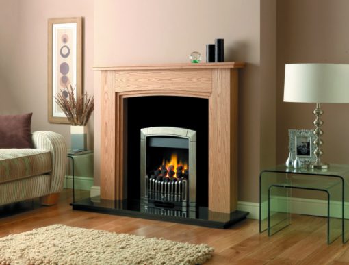 Silver and black fireplace insert with modern fretting in stylish wooden surround